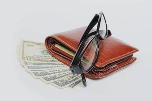 Wallets and glasses on a white background photo