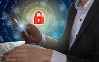 Businessman use Laptop and smartphone with padlock and circle technology background, Cyber Security Data Protection Business Technology Privacy concept, Internet Concept of global business photo
