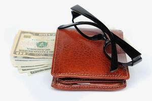 Wallets and glasses on a white background photo