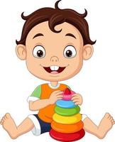 Cartoon little boy playing with colorful pyramid toy vector