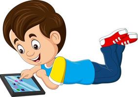 Cartoon happy little boy using tablet vector