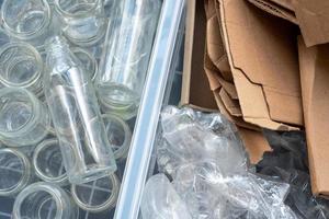 Plastic bottles, glass and cardboard are sorted for recycling. photo