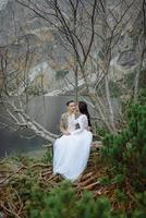 Loving couple on the background of the Sea-eye lake in Poland photo