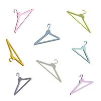 fashion background falling floating clothes hanger pastel color in 3d style