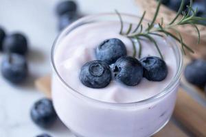 Fresh blueberry yogurt in a clear glass photo