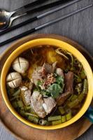 Braised pork kaolao with morning glory and sprouts, local Thai food photo