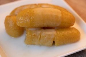 Banana syrup topped with coconut milk photo