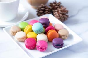 Macarons in a basket and hot tea photo