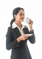 Portrait young beautiful smiling happy woman wear black suit  holding drinking coffee on isolated white background. photo