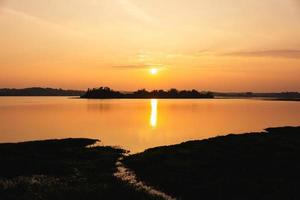 Beautiful Sunset Over Lake in Summer photo