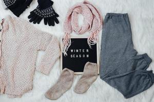 Creative flat lay composition for winter fashion background photo