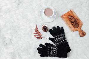 Flat lay with creative composition of winter  accessories background photo