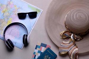 Creative flat lay composition of various traveler or holiday accessories for travel concept background photo