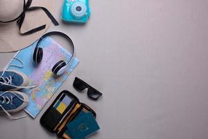 Creative flat lay composition of various traveler or holiday accessories for travel concept background photo