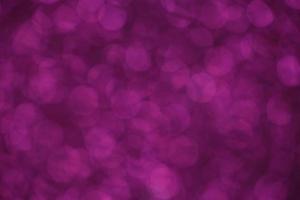 Purple sparkle blurry background with fuzzy dots texture photo