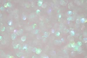 Grey pastel sparkle blurry background with blurred green shiny  dots texture photo