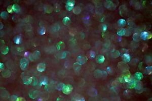 Green sparkle blurry background with sparkling and blurred texture photo