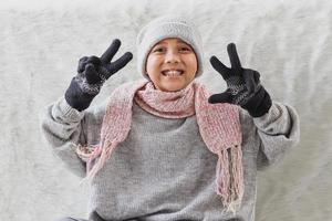 Cute boy wearing winter clothes on winter season photo