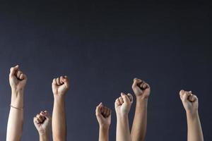 Fists upwards for human rights and democracy concept background photo
