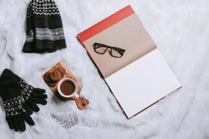Creative flat lay composition for winter background with blank paper for mock up photo