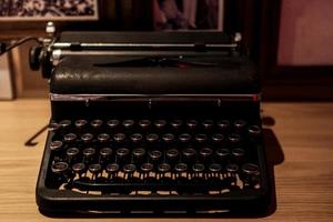 Vintage and retro typewriter on the wooden table photo