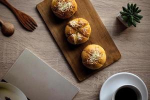 Garlic Cheese Bread or Yugjjog Maneulppang is Korean Popular Street Food served on the table photo