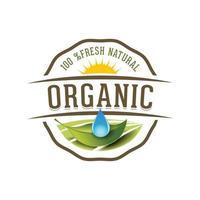 a natural emblem logotype on white background with water drop and leaf and sun that looks fresh and natural for organic food logo product label