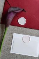 wedding invitation in a gray envelope on a table photo