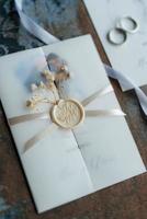 gold wedding rings with a invitation wedding photo