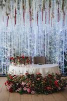 The presidium of the newlyweds in the banquet hall of the restaurant photo