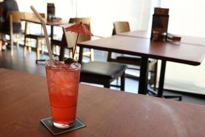 A glass of punch on table. photo