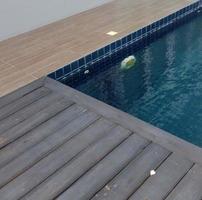 clear water in the swimming pool is covered with mosaics photo