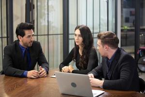 Group of business people collaborating in office or Multiethnic business people in meeting. photo