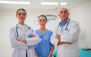 International doctor team. Hospital medical staff. Mixed race Asian and Caucasian doctor and nurse meeting. Clinic and stethoscope.