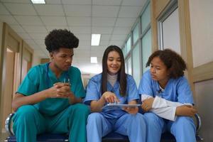 International doctor team. Hospital medical staff. Mixed race Asian and Caucasian doctor and nurse meeting. Clinic and stethoscope. photo