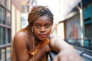 Portrait of young Black skin girls with Afro hairstyle outdoor posing. photo