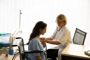 Doctor and patient in hospital photo