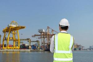Container loading in a Cargo freight ship with industrial crane. Container ship in import and export business logistic company. Industry and Transportation concept. photo