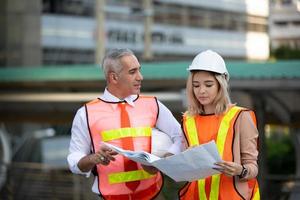 Architect of construction engineer working in construction site and management in the construction site photo