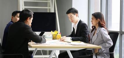 Multiethnic diverse group of business coworkers in team meeting discussion photo