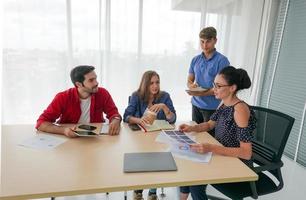 Group of business people collaborating in office or Multiethnic business people in meeting. photo