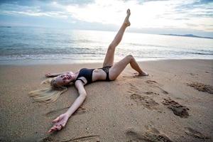The Beautiful Woman Lies On Sea Coast With Nature Vacation Woman photo