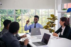 Young start-up business team working in meeting room. photo