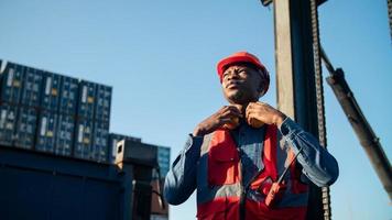 foreman checking containers in the terminal, at import and export business logistic company. photo