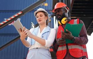 foreman checking containers in the terminal, at import and export business logistic company. photo