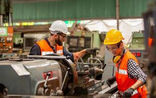 Foreman or worker work at factory site check up machine or products in site. Engineer or Technician checking Material or Machine on Plant. Industrial and Factory. photo