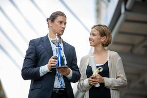 Successful business people standing together widen out showing strong relationship of worker community. A team of businessman and businesswoman expressing a strong group teamwork at the modern office. photo