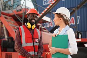 foreman checking containers in the terminal, at import and export business logistic company. photo