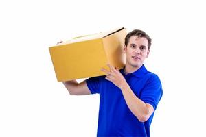 Happy young courier on blue T shirt uniform with parcel and clipboard on white background photo