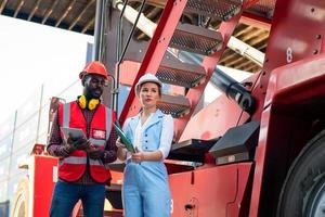 Foreman checking containers in the terminal, at import and export business logistic company. photo